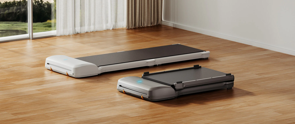 A picture of a WalkingPad showing its slim and low platform design for enhanced safety and stability. The picture shows two WalkingPad treadmills with small gaps between the walking belt and the surface.